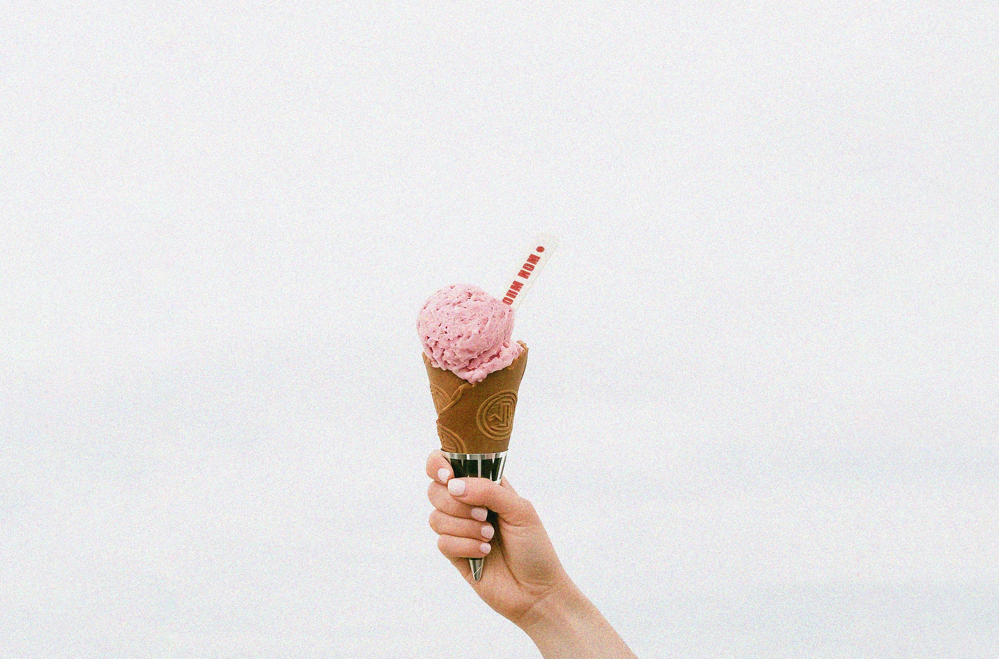 eloolee_a_hand_is_raised_up_towards_the_sky_holding_an_ice_crea_b858ba04-0787-4b82-b344-2ba17a5bf04b_copy_1.jpg